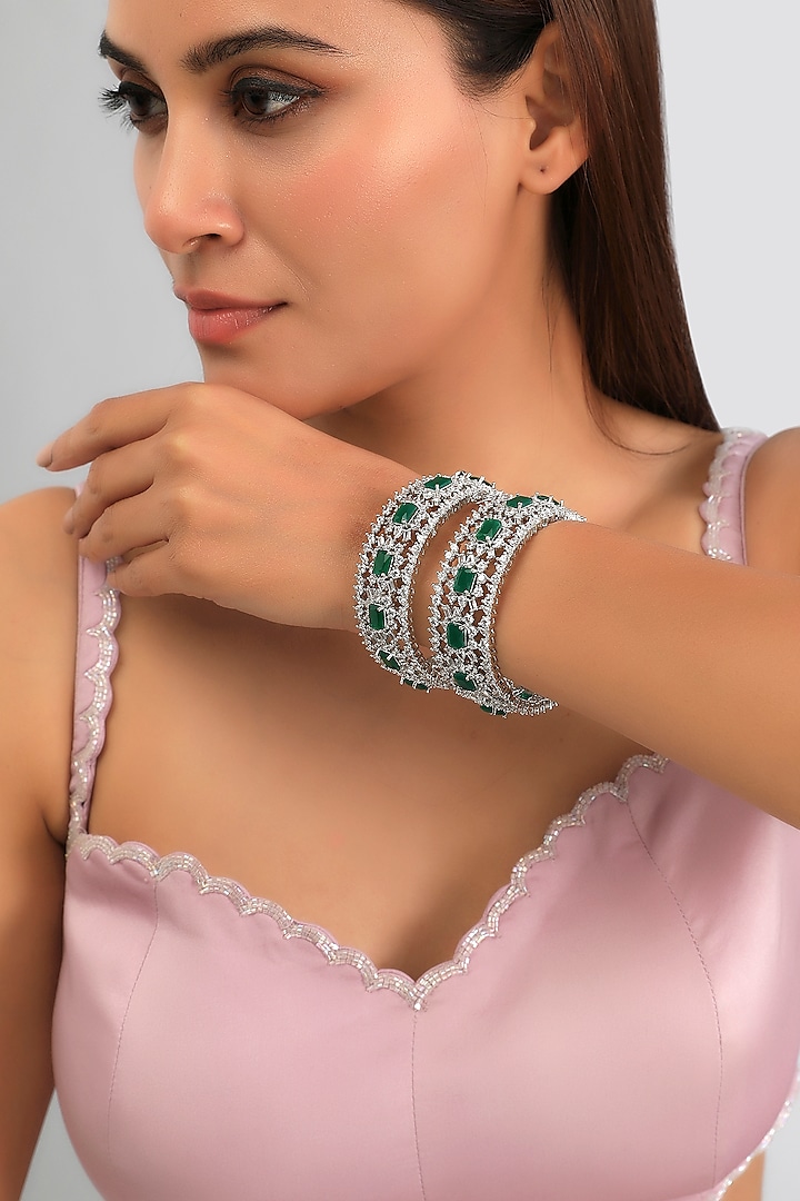 White Finish Diamond & Green Stone Bangles (Set of 2) by Zevar By Geeta at Pernia's Pop Up Shop