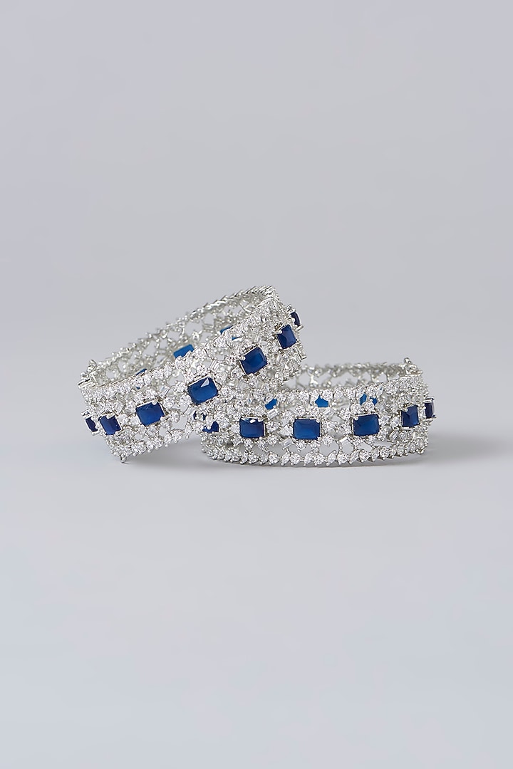 White Finish Diamond & Sapphire Stone Bangles (Set of 2) by Zevar By Geeta at Pernia's Pop Up Shop