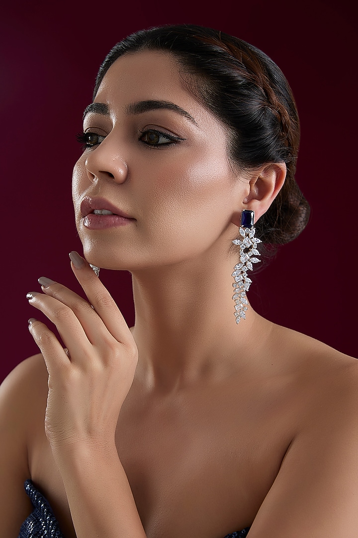 White Finish Diamond Dangler Earrings by Zevar By Geeta at Pernia's Pop Up Shop