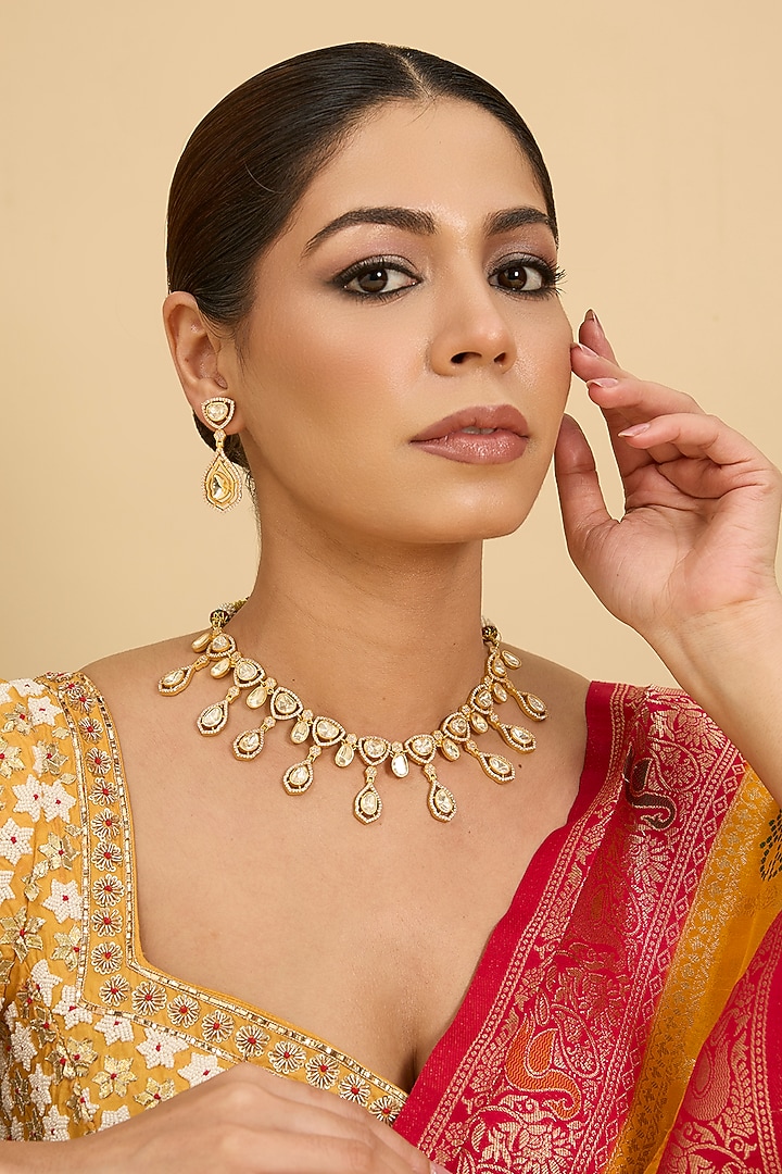 Gold Finish Moissanite Stone Necklace Set by Zevar By Geeta at Pernia's Pop Up Shop