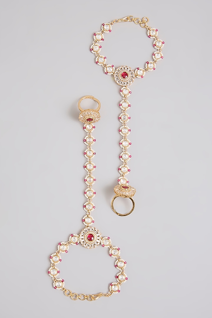 Gold Finish Kundan Polki & Red Stone Haathphool (Set Of 2) by Zevar By Geeta at Pernia's Pop Up Shop