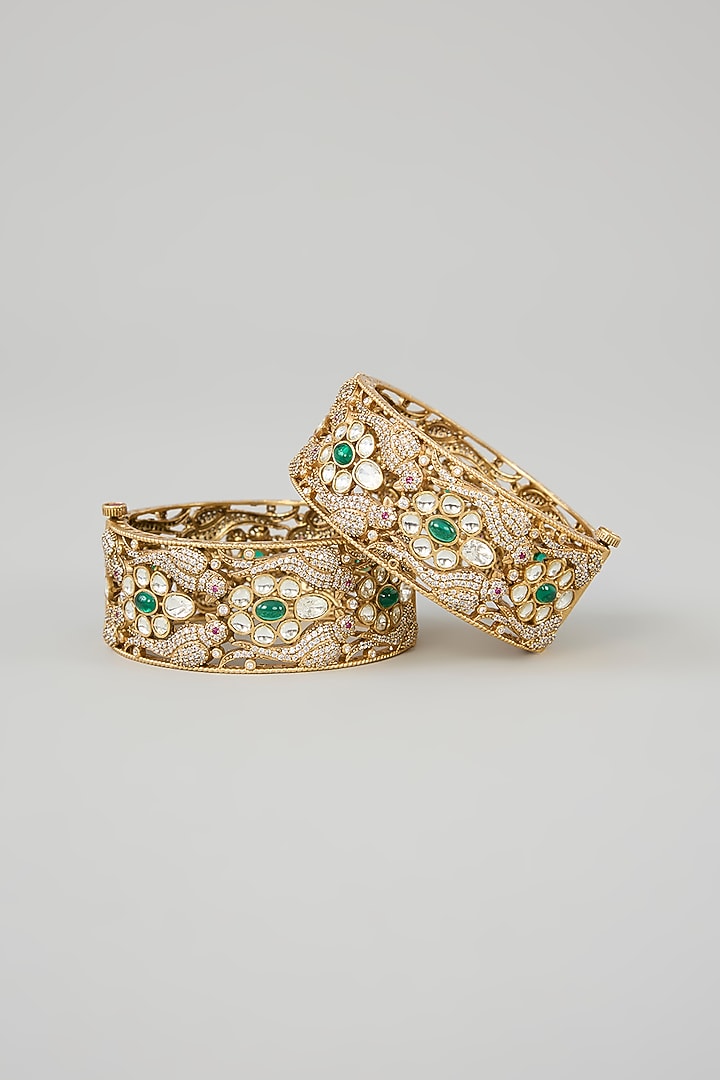 Antique Gold Finish Moissanite & Green Stone Kadas (Set Of 2) by Zevar By Geeta at Pernia's Pop Up Shop