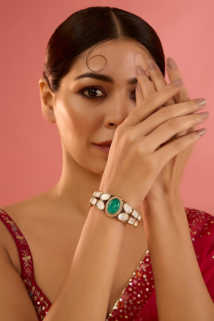 Gold Finish Moissanite & Green Stone Kada by Zevar By Geeta at Pernia's Pop Up Shop