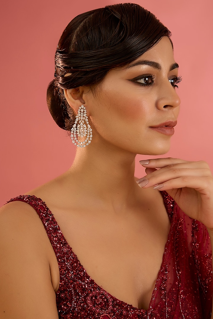 White Finish Diamond Dangler Earrings by Zevar By Geeta at Pernia's Pop Up Shop