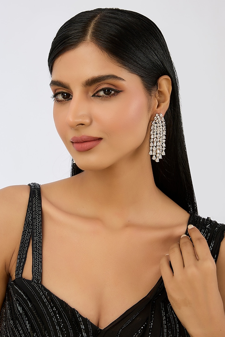 White Finish Diamond Dangler Earrings by Zevar By Geeta at Pernia's Pop Up Shop