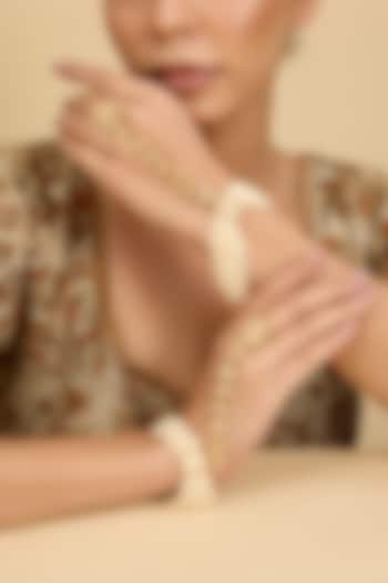 Gold Finish Kundan Polki & Pearl Hathphool (Set Of 2) by Zevar By Geeta at Pernia's Pop Up Shop