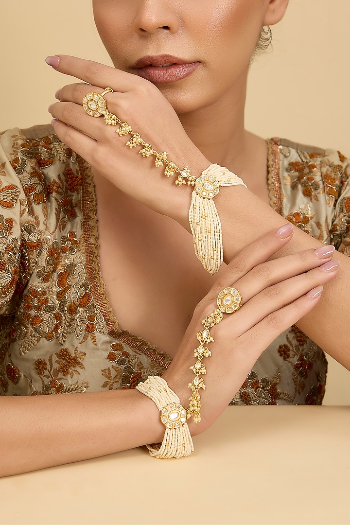 Gold Finish Kundan Polki & Pearl Hathphool (Set Of 2) by Zevar By Geeta at Pernia's Pop Up Shop