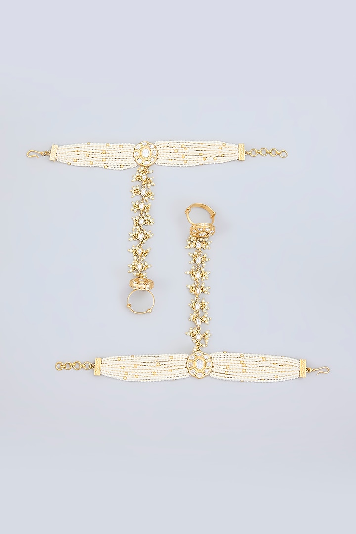 Gold Finish Kundan Polki & Pearl Hathphool (Set Of 2) by Zevar By Geeta at Pernia's Pop Up Shop