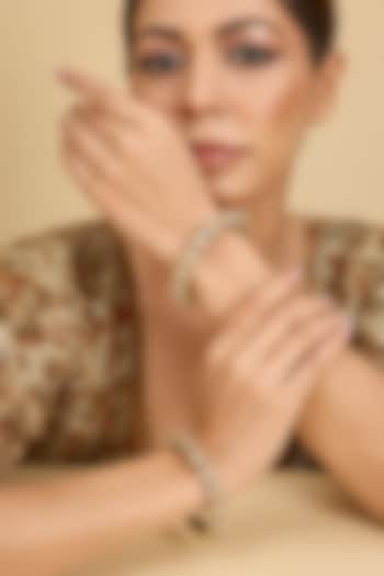 Two-Tone Finish Uncut Kundan Polki Bangles (Set Of 2) by Zevar by Geeta at Pernia's Pop Up Shop