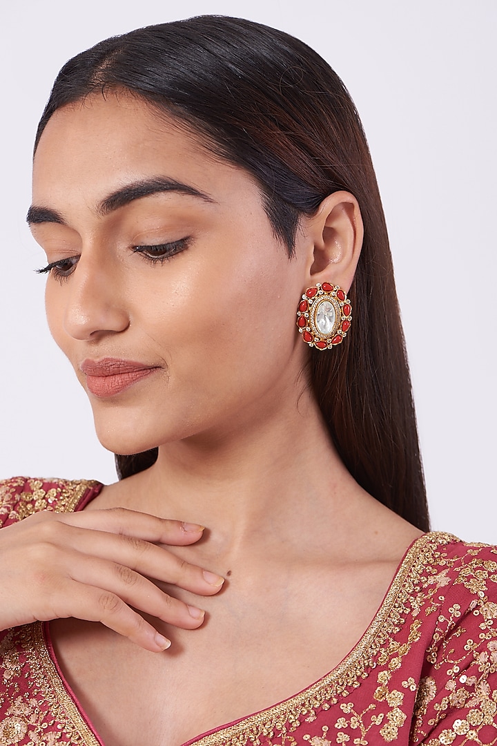 Gold Plated Stud Earrings With Moonga Stones by Zevar By Geeta