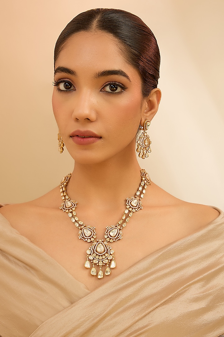 Gold Finish Moissanite Stone Layered Necklace Set by Zevar By Geeta at Pernia's Pop Up Shop