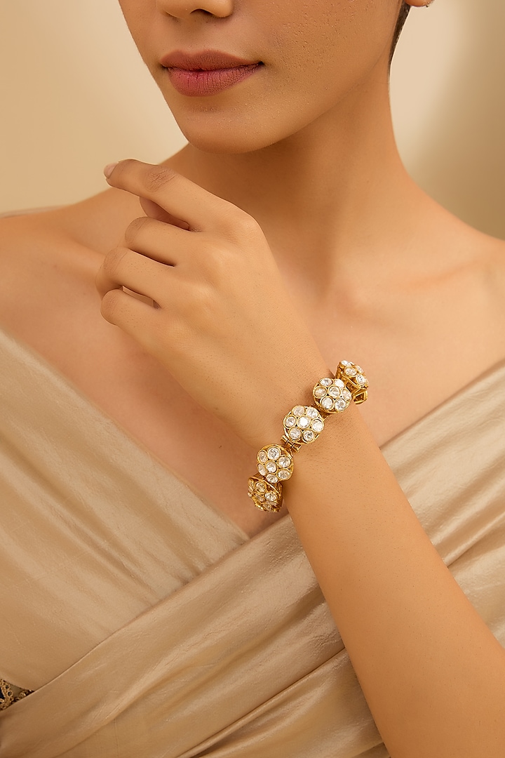 Gold Finish Moissanite Stone Openable Bracelet by Zevar By Geeta at Pernia's Pop Up Shop