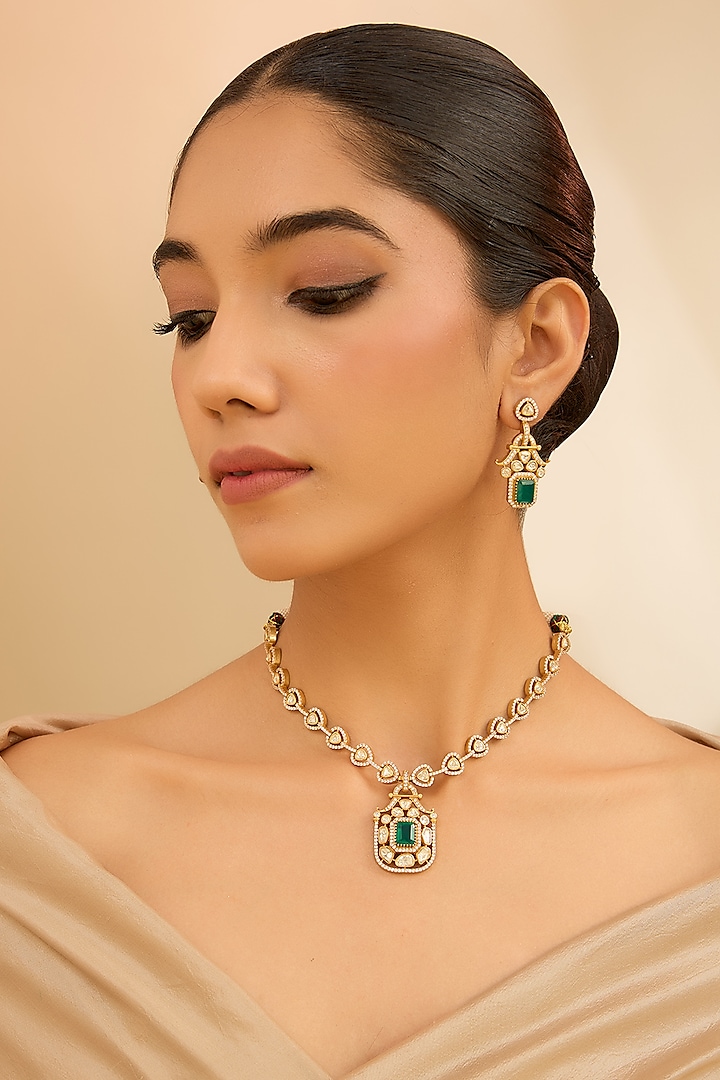 Gold Finish Moissanite & Green Stone Pendant Necklace Set by Zevar By Geeta at Pernia's Pop Up Shop