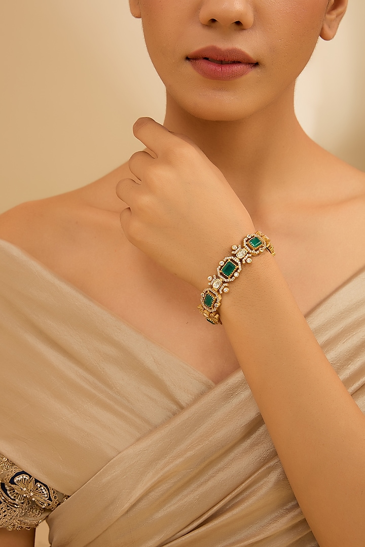 Gold Finish Moissanite & Green Stone Openable Bracelet by Zevar By Geeta at Pernia's Pop Up Shop