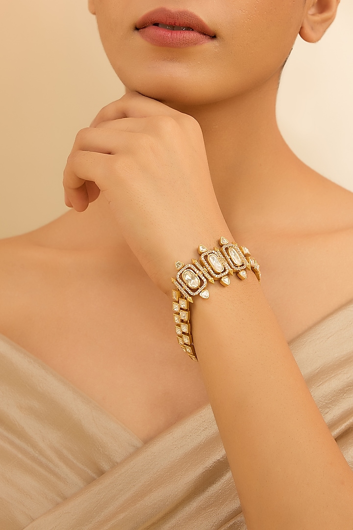 Gold Finish Moissanite Stone Bracelet by Zevar By Geeta at Pernia's Pop Up Shop