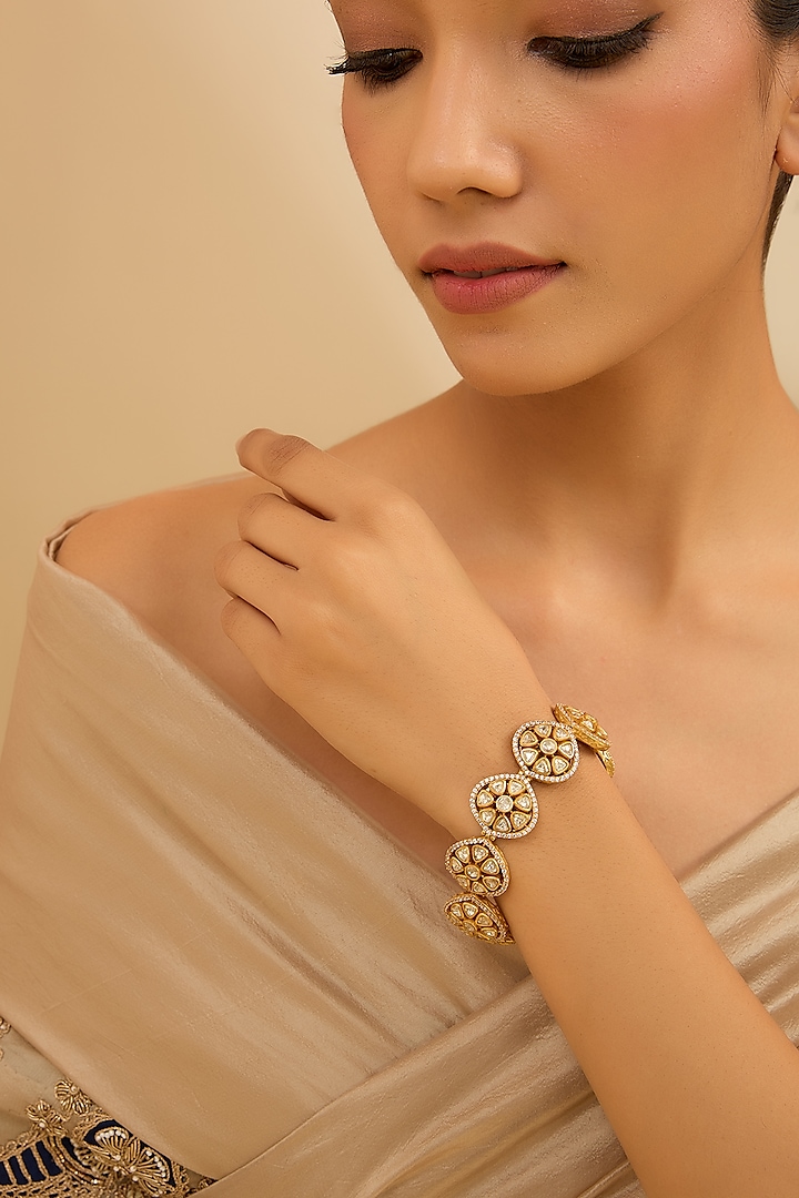 Gold Finish Moissanite Stone Bracelet by Zevar By Geeta at Pernia's Pop Up Shop