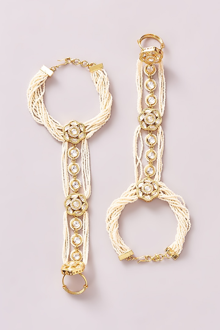 Gold Finish Kundan Polki & Pearl Hathphools (Set Of 2) by Zevar By Geeta at Pernia's Pop Up Shop