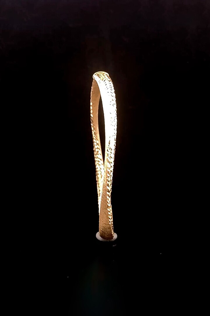 18kt Yellow Gold Finish Twisted Wave Bangle by Zewar By Valchandson jewellers at Pernia's Pop Up Shop