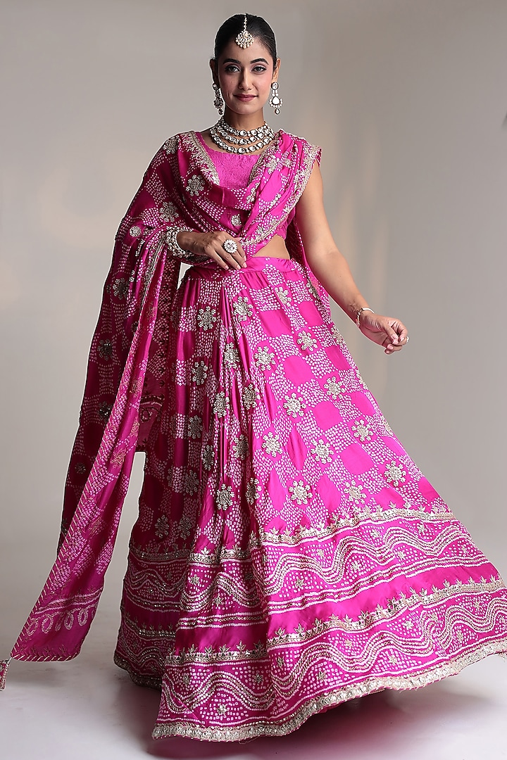 Dark Pink Satin Silk Pearl Embroidered Bandhej Bridal Lehenga Set by Zari Jaipur at Pernia's Pop Up Shop