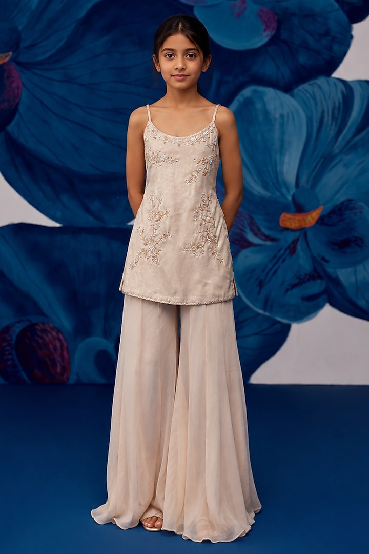 Nude Metallic Satin Aari Embroidered Sharara Set For Girls by Zoon Tribe Kids at Pernia's Pop Up Shop