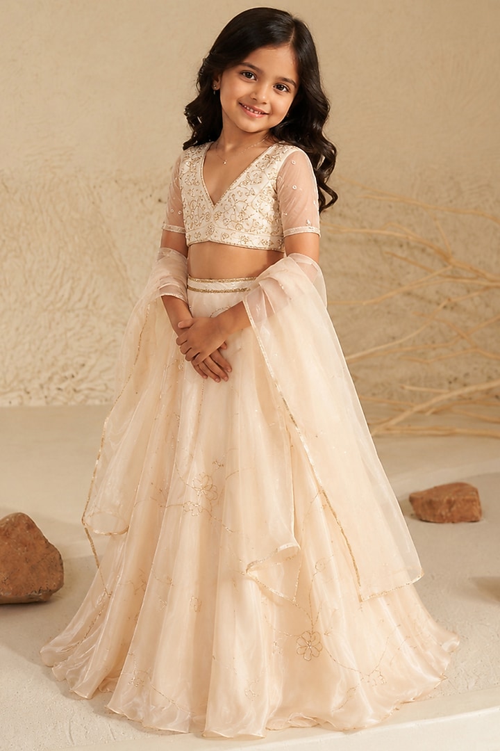 Cream Metallic Organza Hand Embroidered Lehenga Set For Girls by Zoon Tribe Kids at Pernia's Pop Up Shop