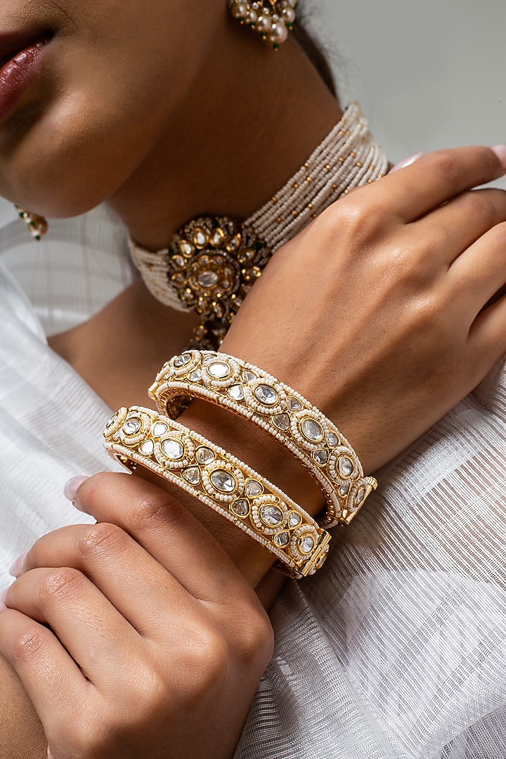 Gold Finish Kundan Polki & White Stone Kadas (Set Of 2) by Zevar King at Pernia's Pop Up Shop