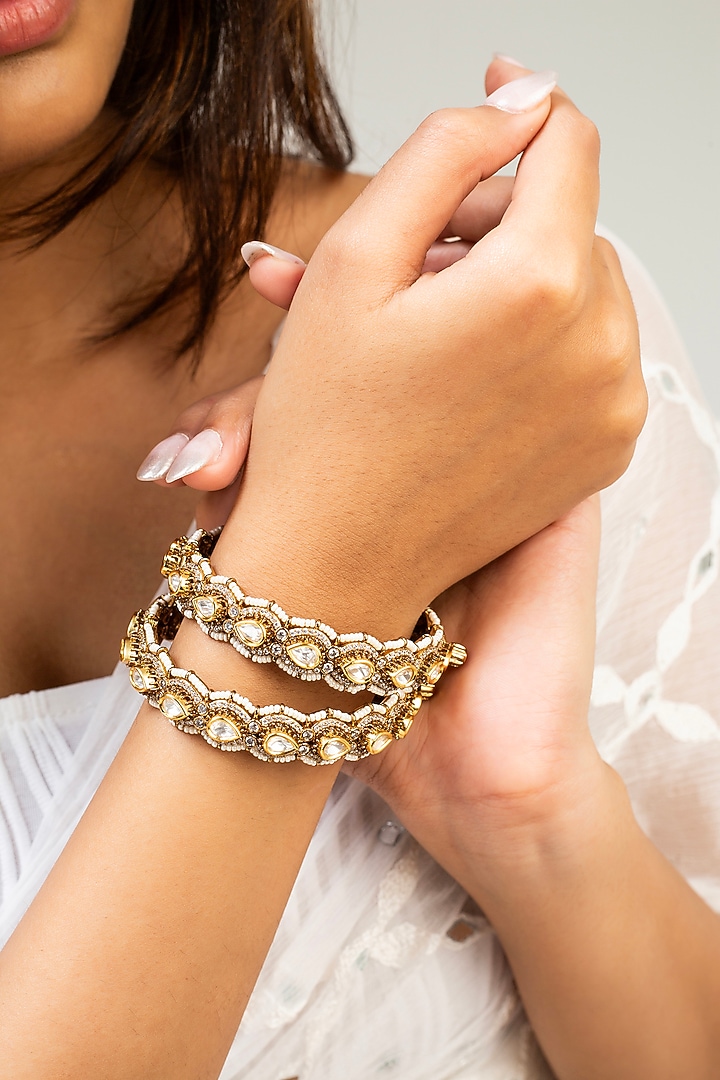 Gold Finish Kundan Polki & White Stone Kadas (Set Of 2) by Zevar King at Pernia's Pop Up Shop