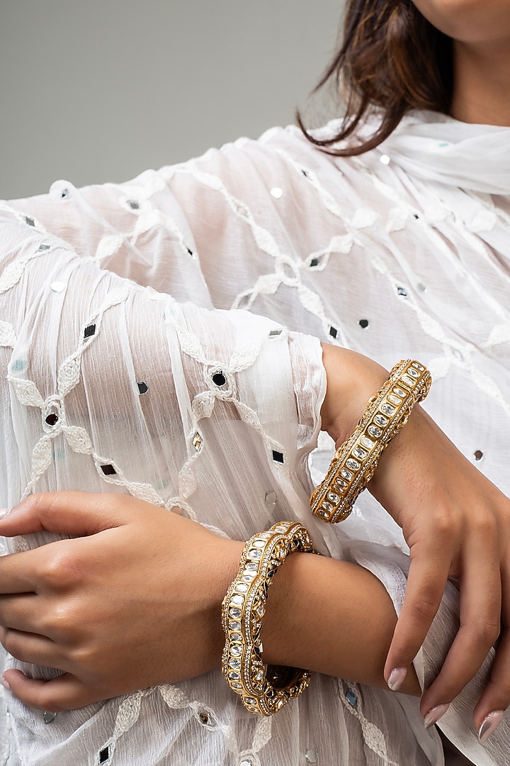 Gold Finish Kundan Polki & Blue Stone Kadas (Set Of 2) by Zevar King at Pernia's Pop Up Shop