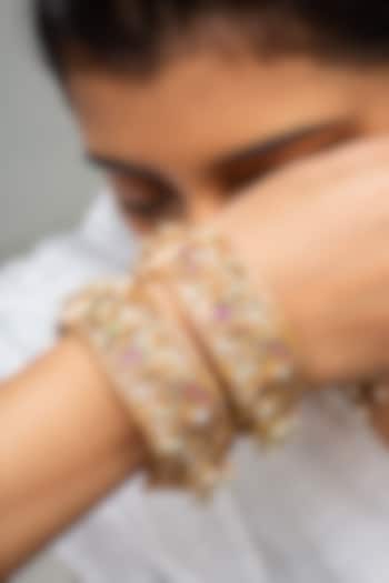 Gold Finish Kundan Polki & Red Stone Kadas (Set Of 2) by Zevar King at Pernia's Pop Up Shop