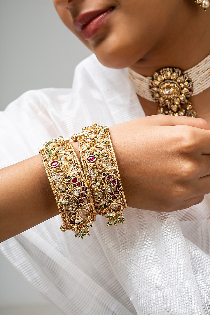 Gold Finish Kundan Polki & Red Stone Kadas (Set Of 2) by Zevar King at Pernia's Pop Up Shop