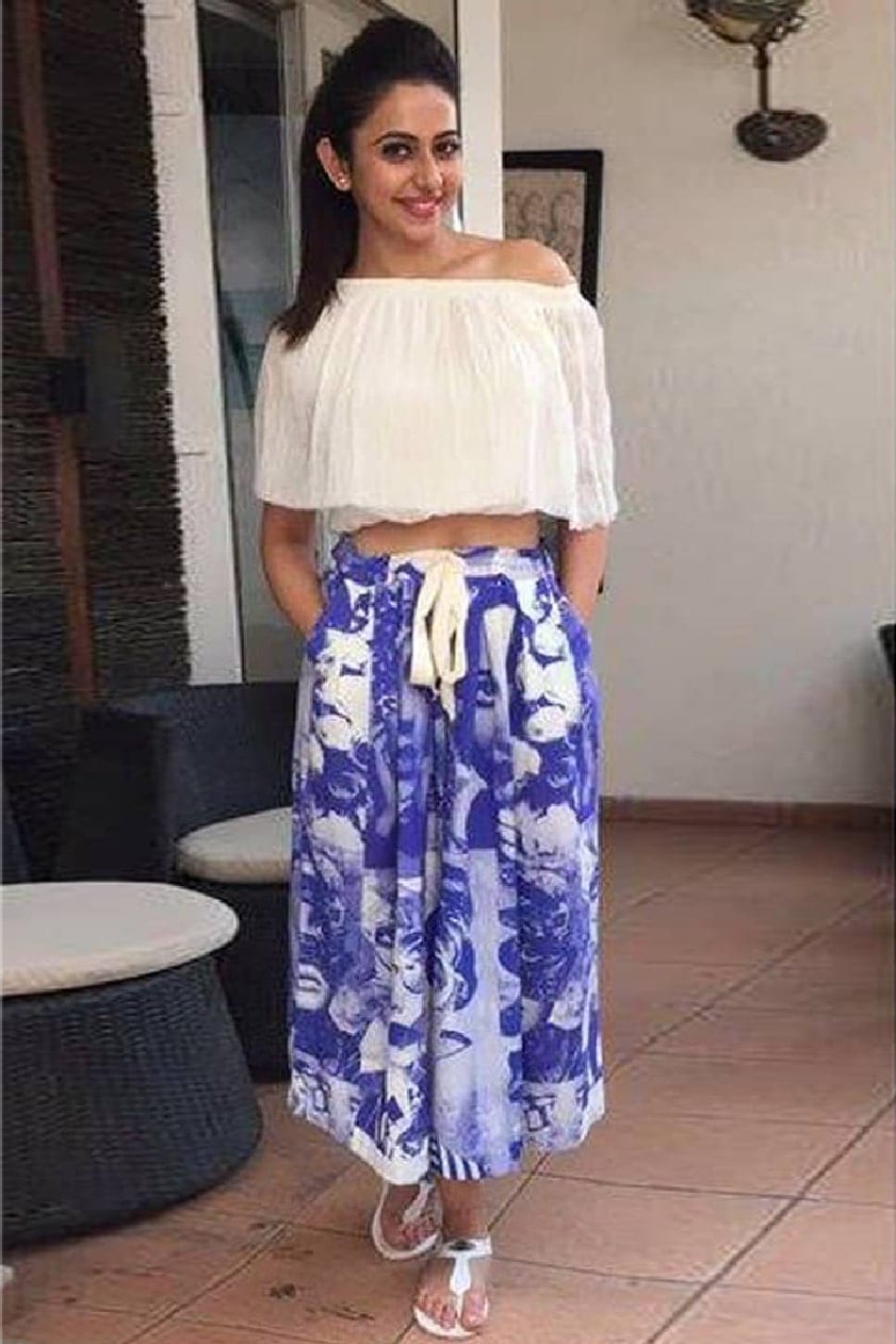 Rakul Preet kept it easy and chic in an off-shoulder top and printed skirt ensemble by Asmita Marwa. She offset the pop-art print and solid blouse with stark white flat sandals.
 by Rakul Preet 
-WHY CELEBS PREFER ASMITA MARWA