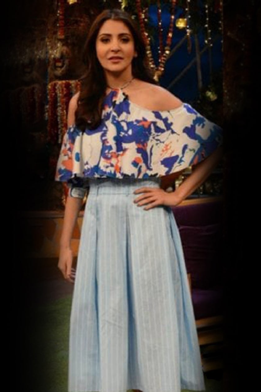 Anushka Sharma was seen on the sets of The Kapil Sharma Show in blue printed coordinates by Hemant and Nandita. The cold shoulder floral top was paired with a striped skirt. 
 by Anushka Sharma-WHY CELEBS PREFER HEMANT AND NANDITA